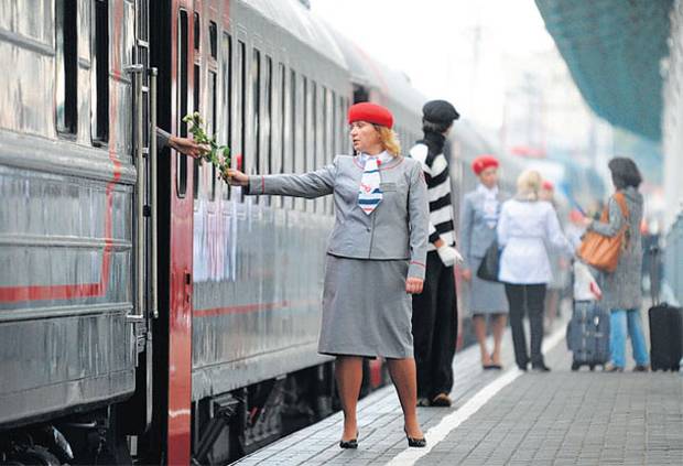 Your%20carriage%20awaits_%20a%20hostess%20of%20the%20new%20train%20running%20between%20Nice%20and%20Moscow.jpg